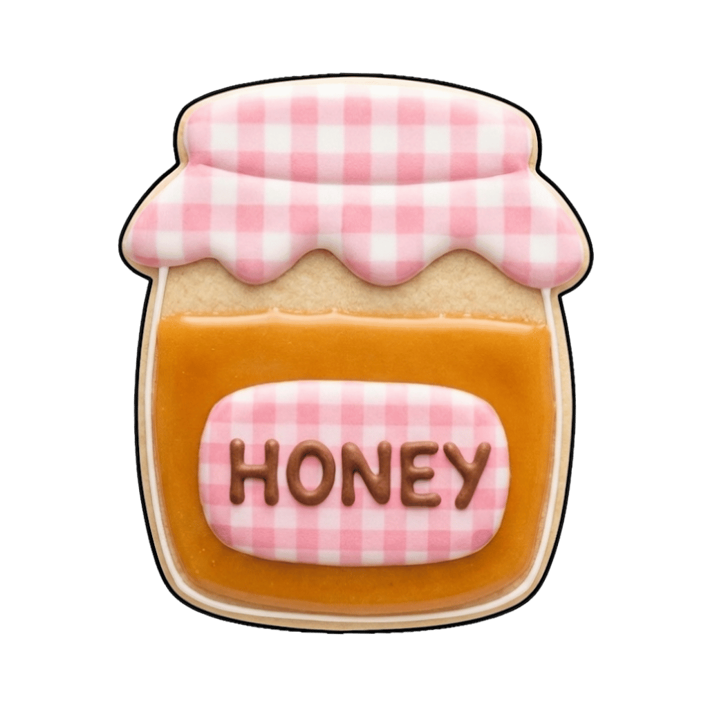 Honey jar cookie with amber honey filling and a pink gingham fabric lid label that says HONEY