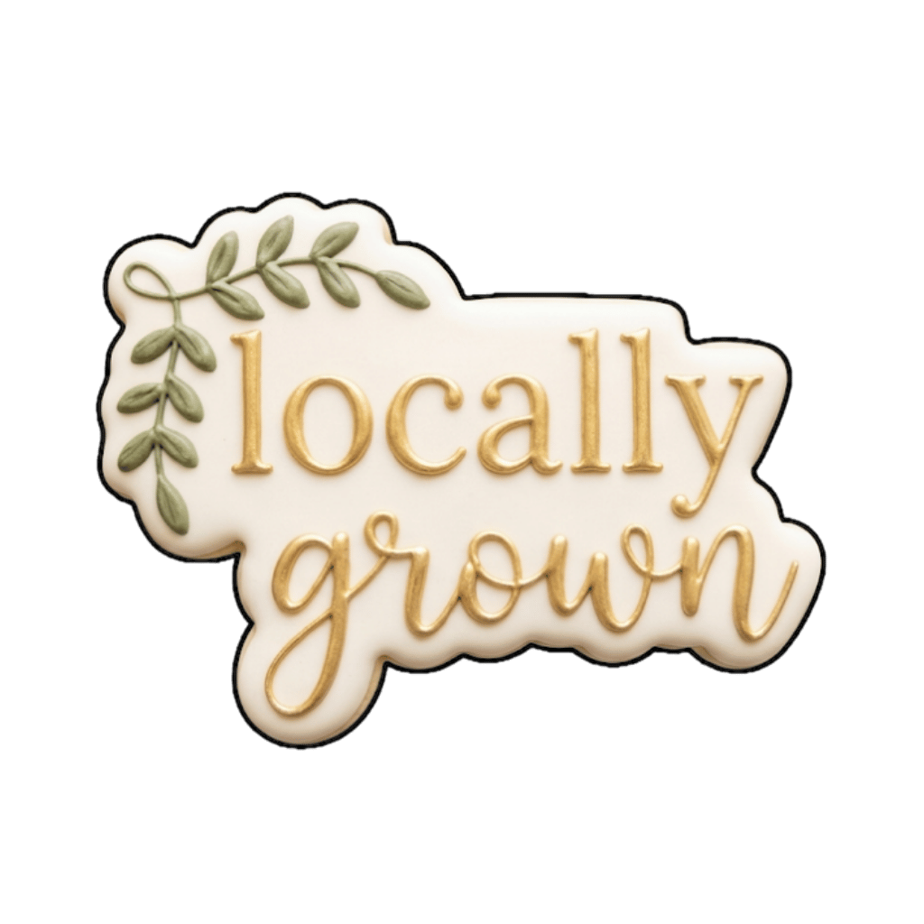 Plaque cookie that says locally grown in gold script