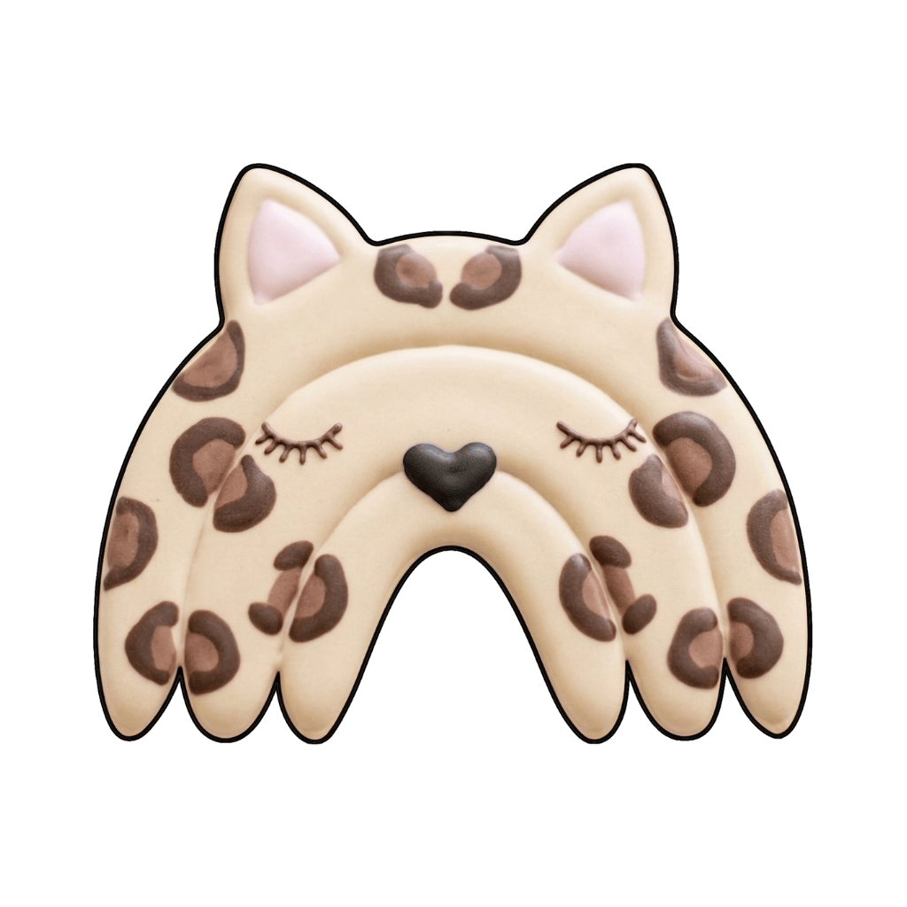 Leopard-print arch cookie with closed eyes and a black heart-shaped nose