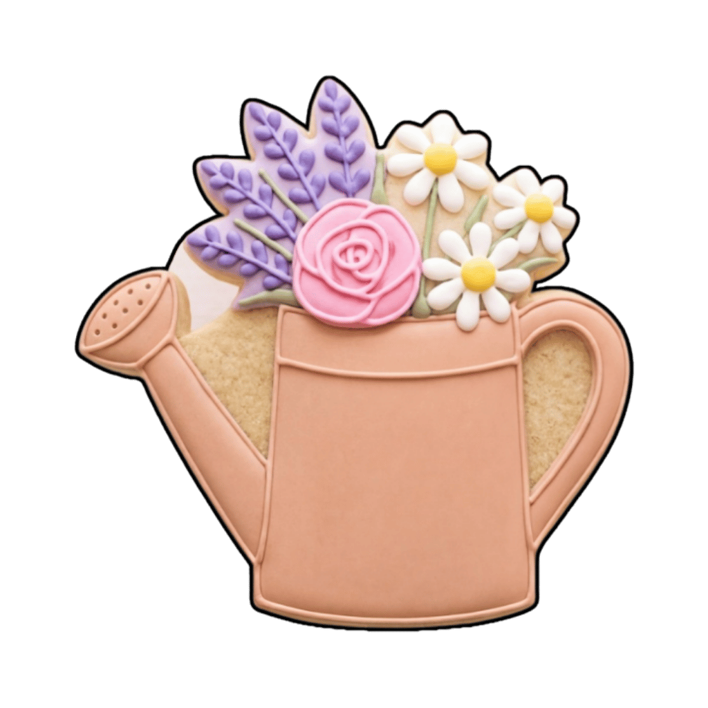 Watering can cookie filled with lavender sprigs, white daisies, and a pink rose